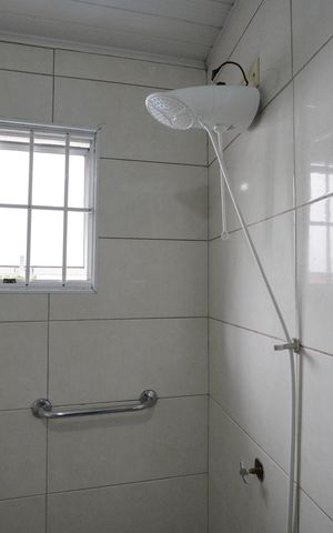 Casa à venda com 128m², 3 quartos e 2 vagasBanheiro