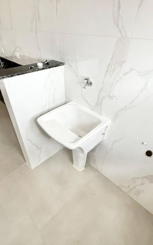 Apartamento à venda com 45m², 2 quartos e 1 vaga Apartamento à venda com 45m², 2 quartos e 1 vagaCozinha e Área de Serviço