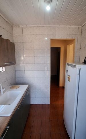 Casa à venda com 106m², 2 quartos e 2 vagas Casa à venda com 106m², 2 quartos e 2 vagasCozinha