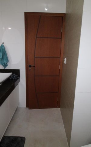 Casa de condomínio para alugar com 285m², 3 quartos e 4 vagasBanheiro da Suíte 1
