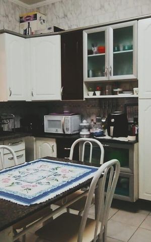 Casa à venda com 132m², 3 quartos e 3 vagas Casa à venda com 132m², 3 quartos e 3 vagasCozinha