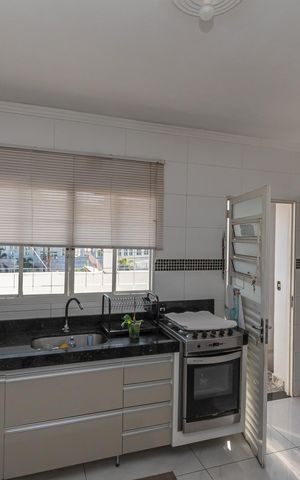 Casa à venda com 125m², 3 quartos e 3 vagas Casa à venda com 125m², 3 quartos e 3 vagasCozinha
