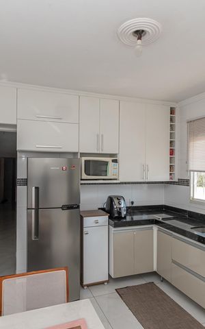 Casa à venda com 125m², 3 quartos e 3 vagas Casa à venda com 125m², 3 quartos e 3 vagasCozinha