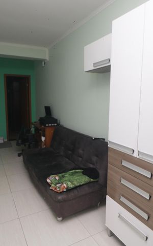 Casa à venda com 116m², 3 quartos e 2 vagasSala de TV