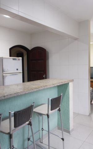 Casa de condomínio para alugar com 220m², 4 quartos e 2 vagasCozinha