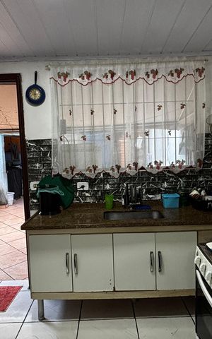 Casa à venda com 108m², 2 quartos e 2 vagas Casa à venda com 108m², 2 quartos e 2 vagasCozinha