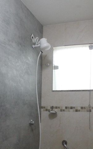 Casa de condomínio à venda com 118m², 4 quartos e 2 vagasBanheiro da Suíte 1