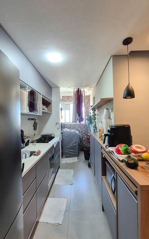 Apartamento à venda com 57m², 2 quartos e 1 vaga Apartamento à venda com 57m², 2 quartos e 1 vagaCozinha e Área de Serviço