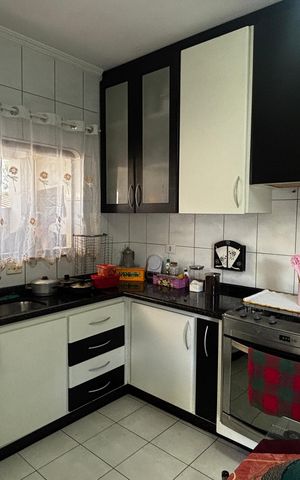 Casa à venda com 118m², 4 quartos e 4 vagas Casa à venda com 118m², 4 quartos e 4 vagasCozinha