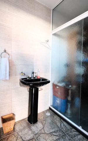 Casa à venda com 400m², 4 quartos e 4 vagasBanheiro 3