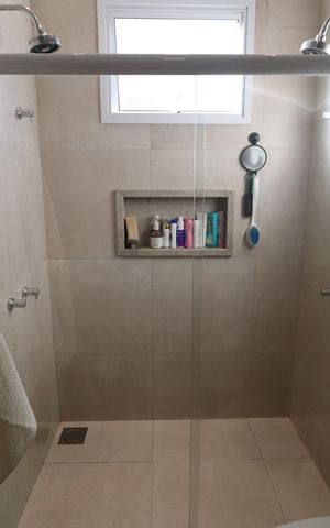 Casa de condomínio para alugar com 200m², 3 quartos e 4 vagasBanheiro da Suíte 2