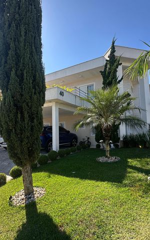 Casa de condomínio para alugar com 320m², 3 quartos e 6 vagas Casa de condomínio para alugar com 320m², 3 quartos e 6 vagasFachada