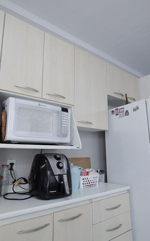Casa à venda com 90m², 2 quartos e 2 vagas Casa à venda com 90m², 2 quartos e 2 vagasCozinha