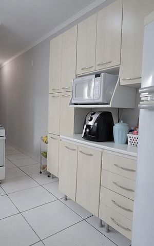 Casa à venda com 90m², 2 quartos e 2 vagas Casa à venda com 90m², 2 quartos e 2 vagasCozinha