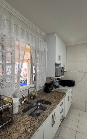 Casa de condomínio para alugar com 180m², 3 quartos e 2 vagasCozinha e Área de Serviço