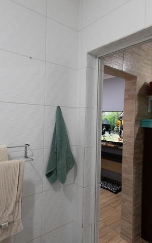 Casa à venda com 70m², 4 quartos e sem vagaBanheiro da Suíte