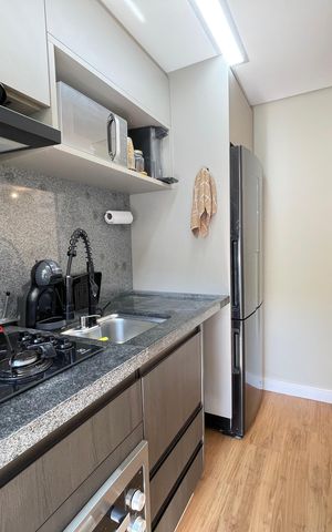 Apartamento à venda com 44m², 2 quartos e 1 vaga Apartamento à venda com 44m², 2 quartos e 1 vagaCozinha e Área de Serviço