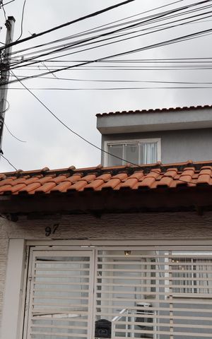 Casa à venda com 152m², 3 quartos e 3 vagasFachada e portão