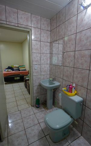 Casa à venda com 233m², 3 quartos e 6 vagasBanheiro social