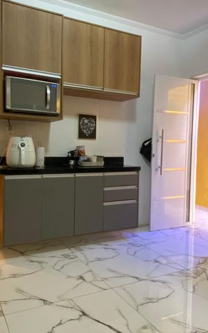 Casa à venda com 125m², 2 quartos e 2 vagas Casa à venda com 125m², 2 quartos e 2 vagasCozinha