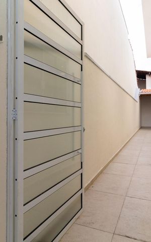 Casa à venda com 125m², 3 quartos e 3 vagas Casa à venda com 125m², 3 quartos e 3 vagasCorredor externo