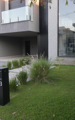 Casa de condomínio para alugar com 312m², 4 quartos e 4 vagasFachada