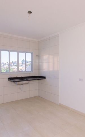 Casa à venda com 73m², 2 quartos e 2 vagas Casa à venda com 73m², 2 quartos e 2 vagasCozinha