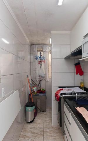 Apartamento à venda com 48m², 2 quartos e 1 vaga Apartamento à venda com 48m², 2 quartos e 1 vagaCozinha e Área de Serviço