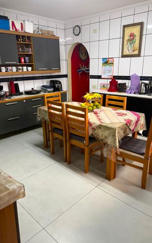 Casa à venda com 116m², 2 quartos e 2 vagas Casa à venda com 116m², 2 quartos e 2 vagasCozinha