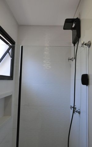 Casa de condomínio para alugar com 63m², 2 quartos e 2 vagasBanheiro da Suíte 1