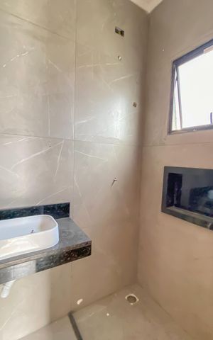 Casa à venda com 65m², 2 quartos e 2 vagas Casa à venda com 65m², 2 quartos e 2 vagasBanheiro da Suíte 1
