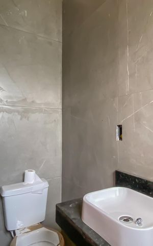 Casa à venda com 65m², 2 quartos e 2 vagas Casa à venda com 65m², 2 quartos e 2 vagasBanheiro da Suíte 1