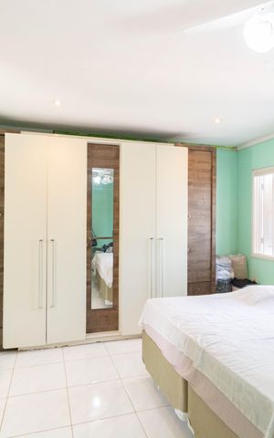 Casa à venda com 150m², 4 quartos e 2 vagas Casa à venda com 150m², 4 quartos e 2 vagasQuarto