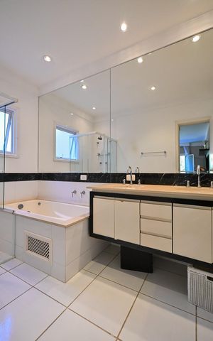 Casa de condomínio à venda com 310m², 4 quartos e 4 vagasBanheiro Suíte 2