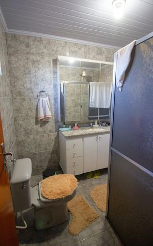 Casa à venda com 250m², 5 quartos e 3 vagasBanheiro da suíte