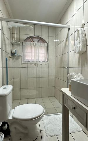 Casa à venda com 120m², 3 quartos e 2 vagas Casa à venda com 120m², 3 quartos e 2 vagasBanheiro 1