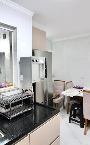 Casa à venda com 68m², 2 quartos e 2 vagas Casa à venda com 68m², 2 quartos e 2 vagasCozinha