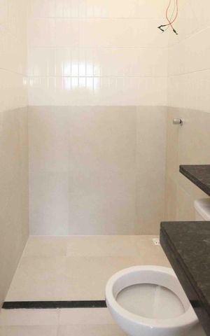 Casa à venda com 104m², 3 quartos e 2 vagas Casa à venda com 104m², 3 quartos e 2 vagasBanheiro da Suite