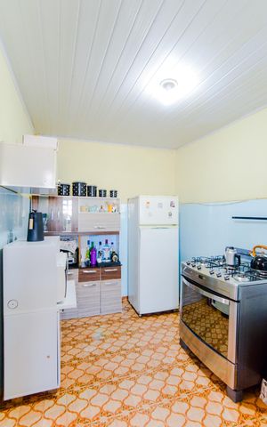 Casa à venda com 128m², 3 quartos e sem vagaSala/Cozinha 