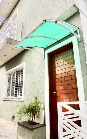Casa à venda com 70m², 2 quartos e 1 vaga Casa à venda com 70m², 2 quartos e 1 vagaFachada