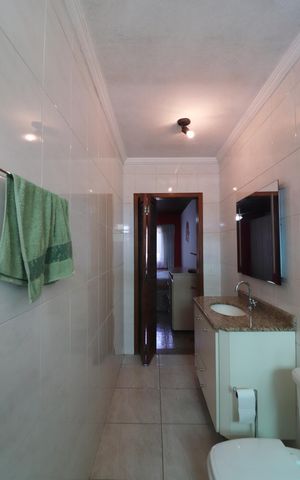 Casa à venda com 180m², 3 quartos e 2 vagasQuarto 1 - Suíte Banheiro 