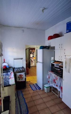 Casa à venda com 90m², 2 quartos e 2 vagas Casa à venda com 90m², 2 quartos e 2 vagasCozinha