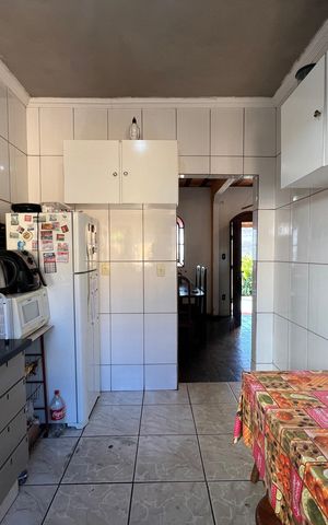 Casa à venda com 100m², 4 quartos e 5 vagas Casa à venda com 100m², 4 quartos e 5 vagasCozinha