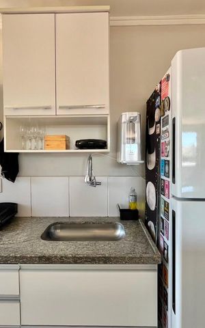 Apartamento à venda com 40m², 2 quartos e 1 vaga Apartamento à venda com 40m², 2 quartos e 1 vagaCozinha e Área de Serviço