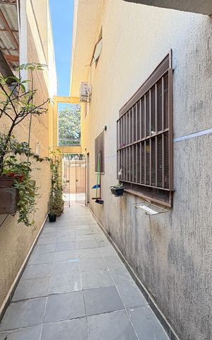 Casa à venda com 113m², 3 quartos e 3 vagas Casa à venda com 113m², 3 quartos e 3 vagasCorredor externo
