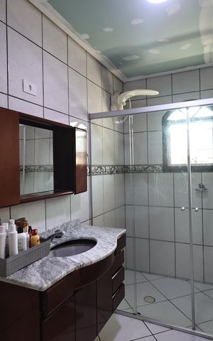 Casa à venda com 225m², 3 quartos e 5 vagas Casa à venda com 225m², 3 quartos e 5 vagasBanheiro da Suíte 1