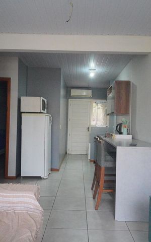 Casa de condomínio à venda com 48m², 2 quartos e 2 vagasSala