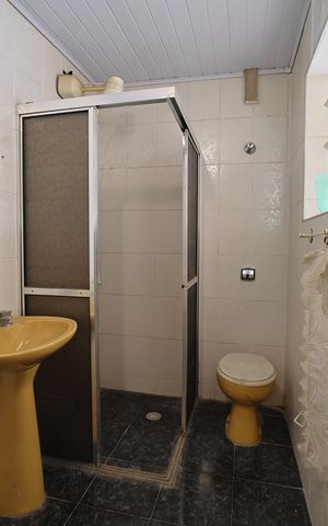 Casa à venda com 110m², 2 quartos e 4 vagasBanheiro e Área de Serviço