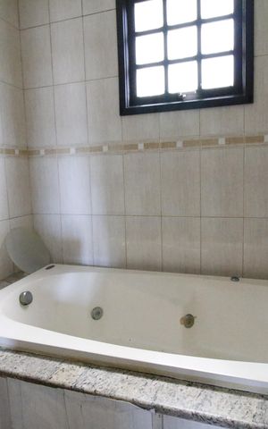 Casa de condomínio para alugar com 371m², 4 quartos e 4 vagasBanheiro da Suíte 4