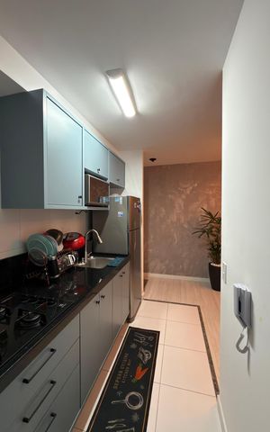 Apartamento à venda com 48m², 2 quartos e 1 vaga Apartamento à venda com 48m², 2 quartos e 1 vagaCozinha e Área de Serviço